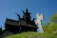 Ancient Stave Church and Stone Cross