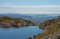 Mountain Tarn Overlooking City and Fjord